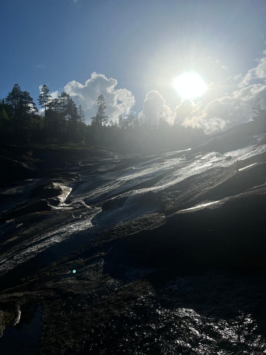 sun hitting the rocks and river at the Brokke Badeplass